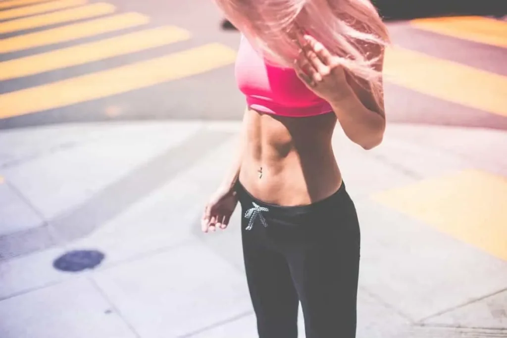Woman with toned stomach after LA-EMS Body Sculpting Treatment Plaistow